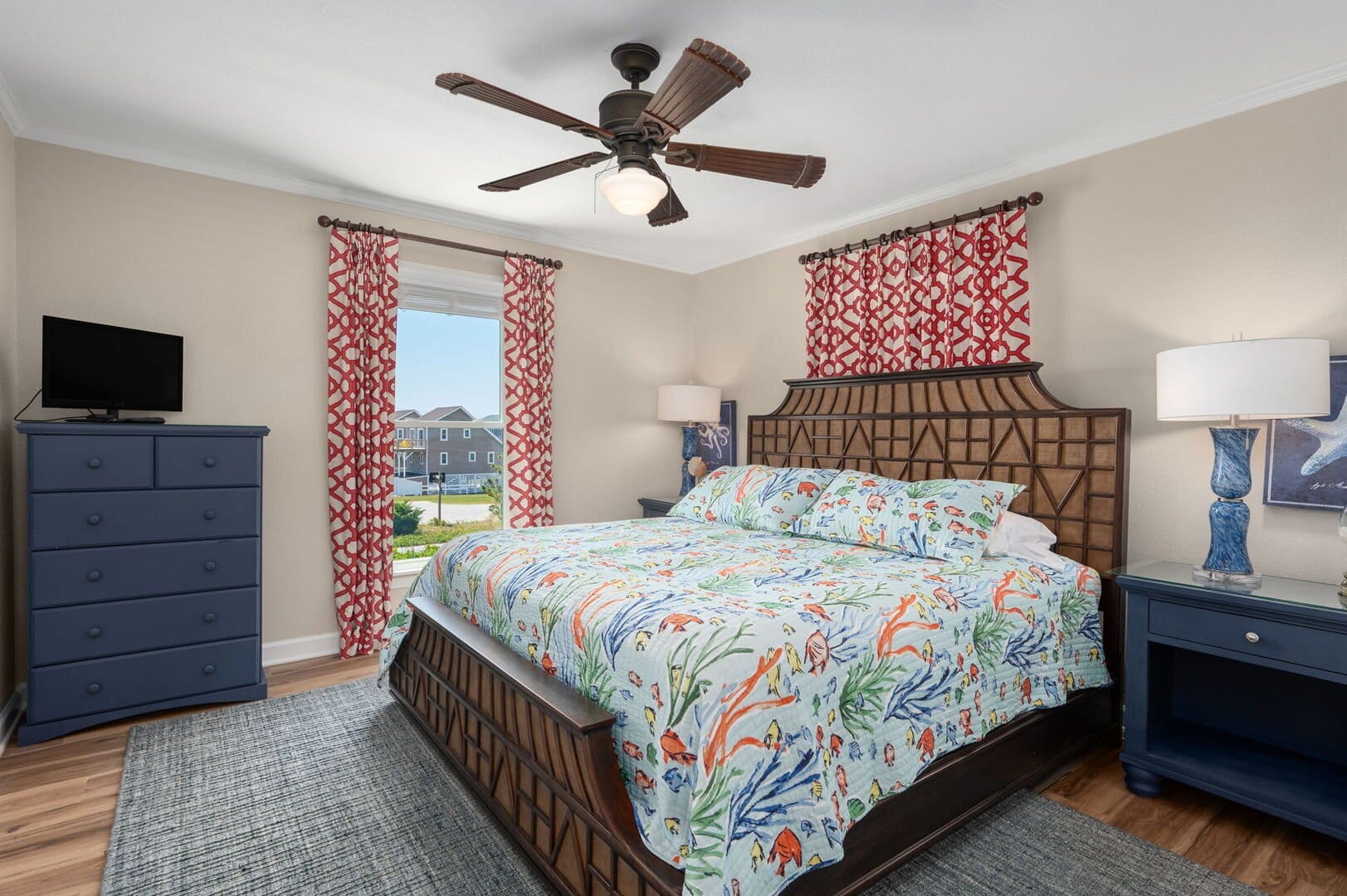 Coastal-themed bedroom with colorful bedding.