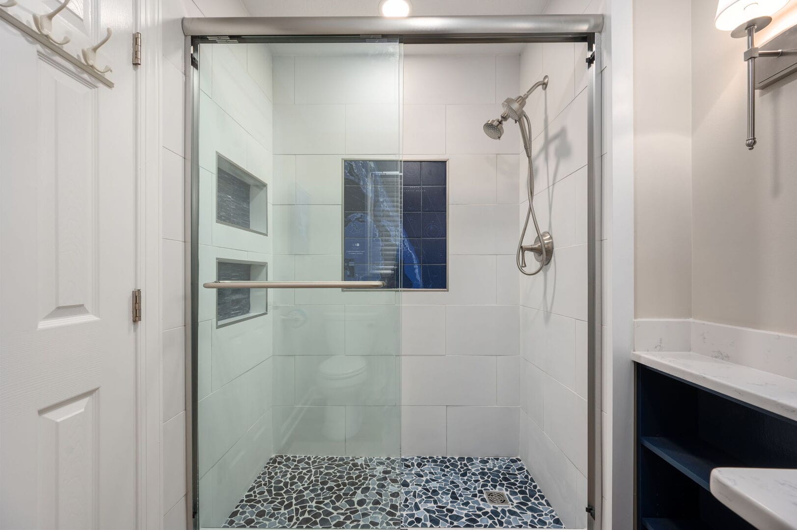 Modern shower with glass door.
