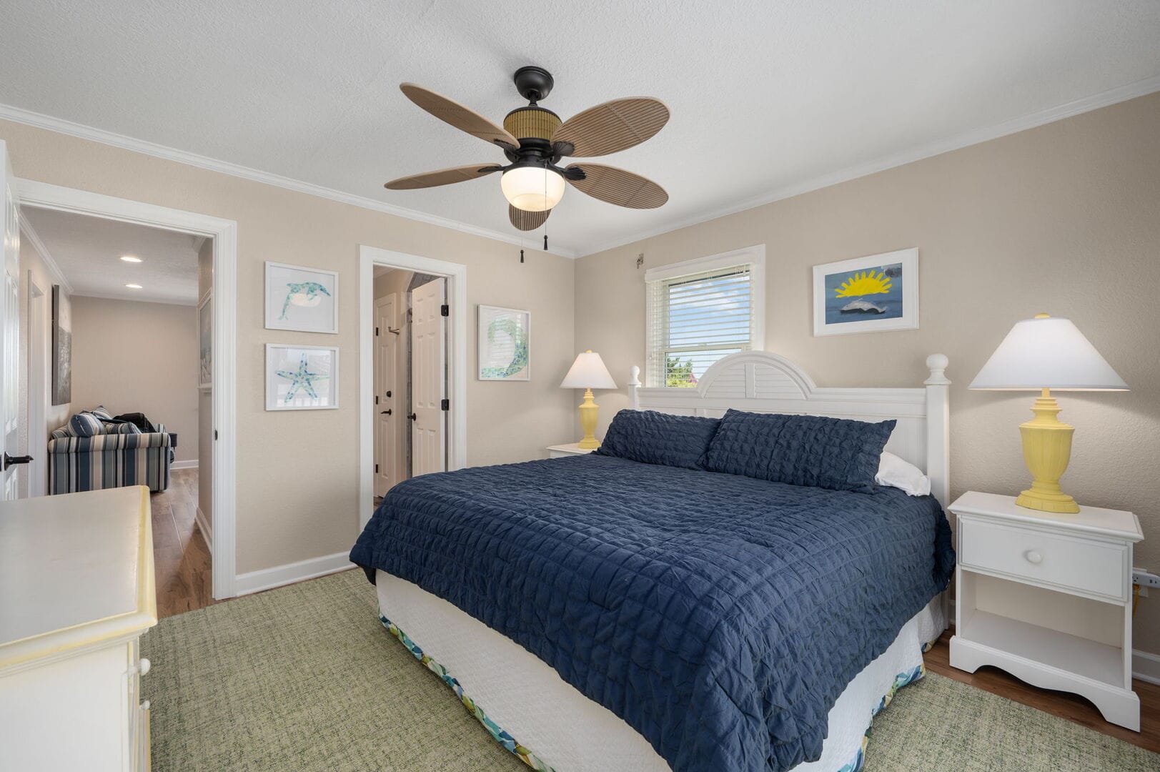 Cozy bedroom with ceiling fan.