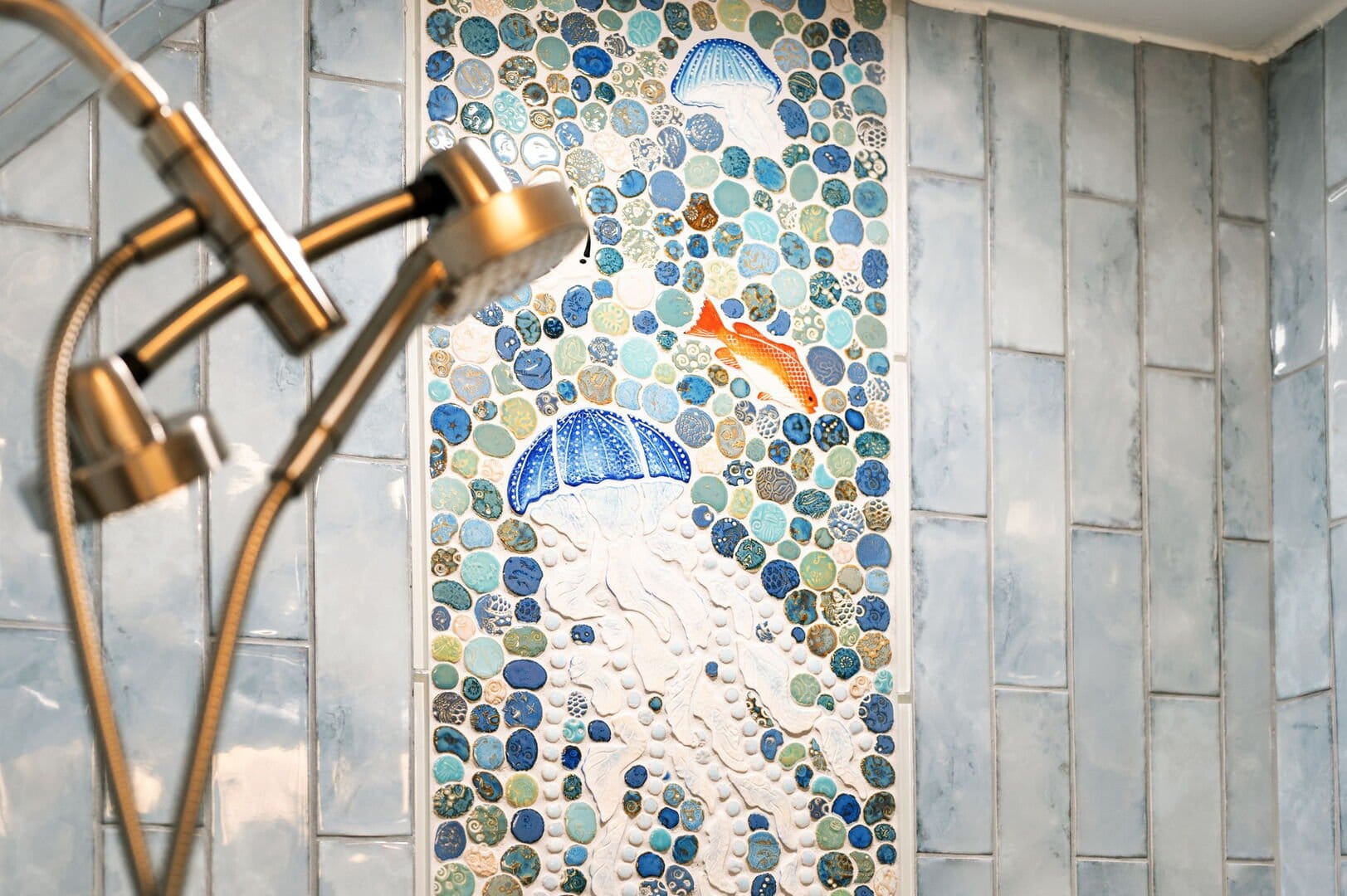 Shower tiles with ocean mosaic.