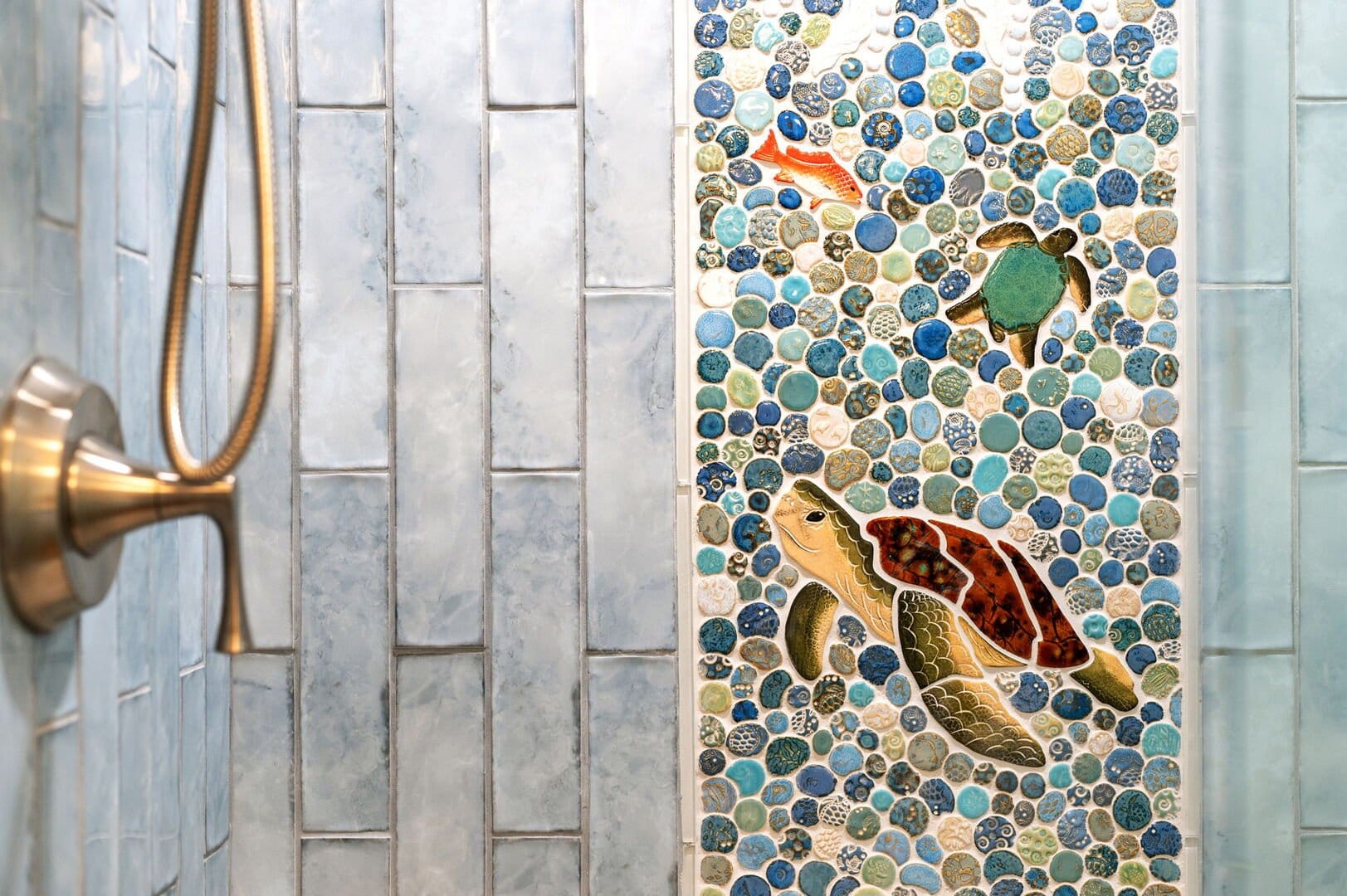 Sea-themed shower tile design.