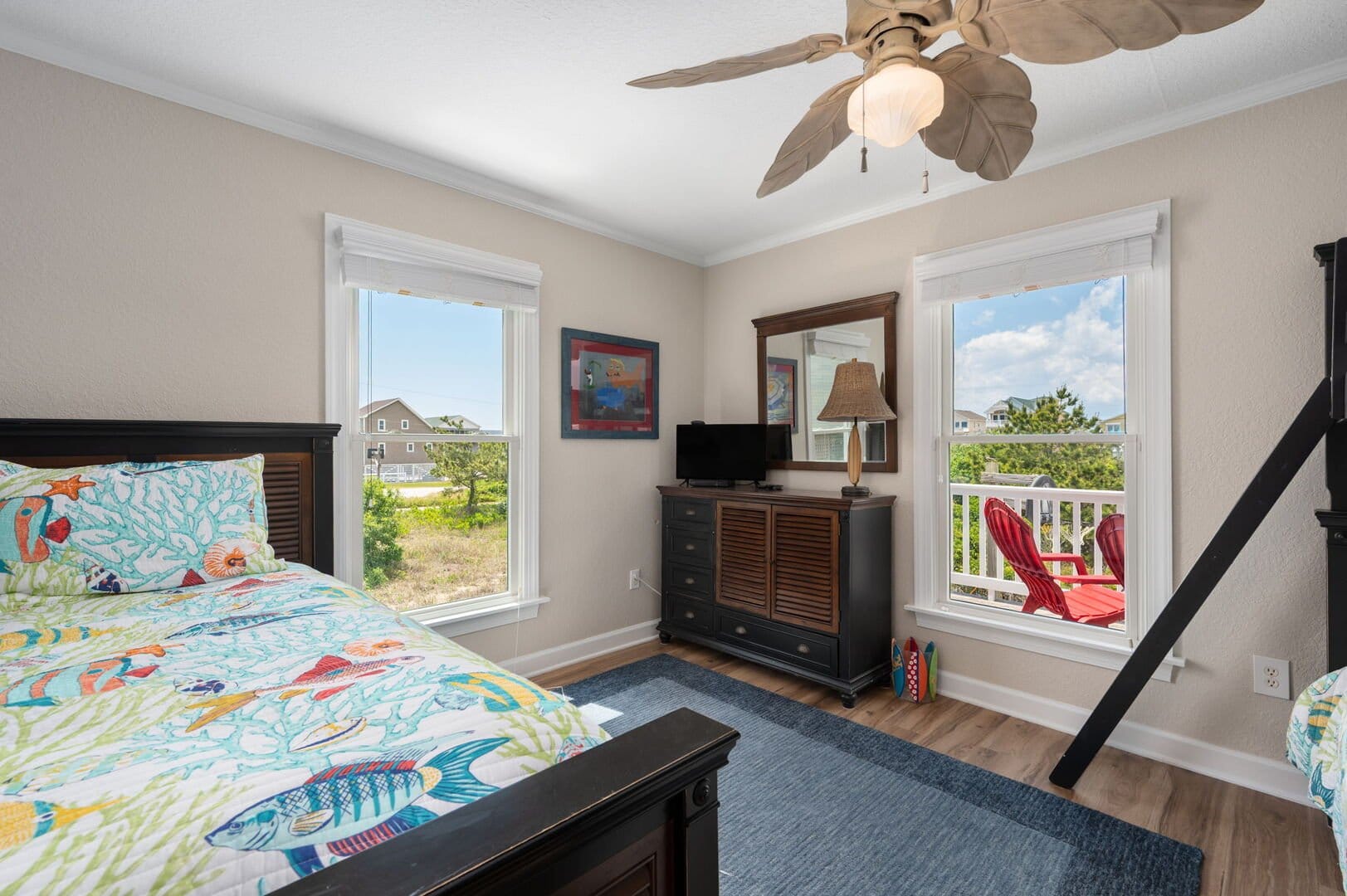 Bedroom with ocean-themed bedding.