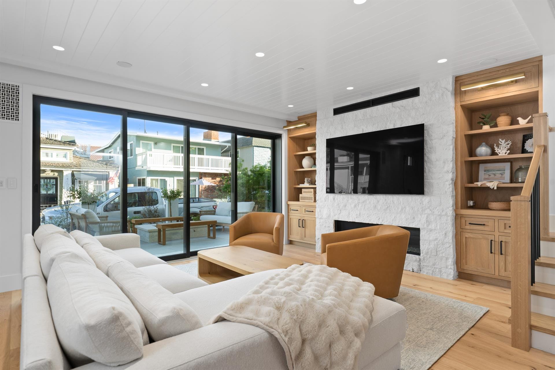 Modern living room with large windows.