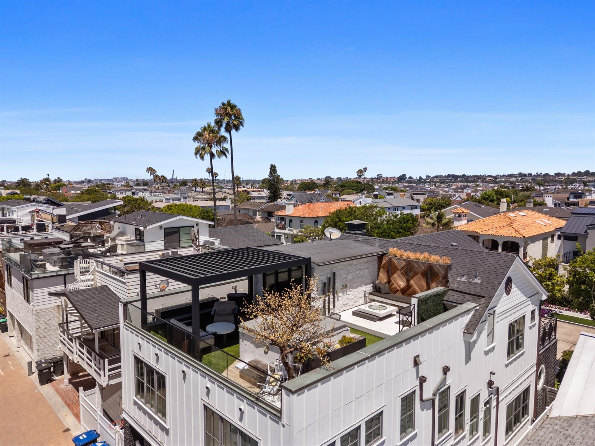 Rooftop patio overlooking suburban neighborhood.