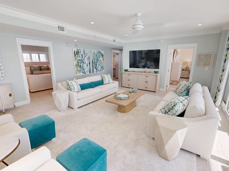 Modern living room with teal accents.