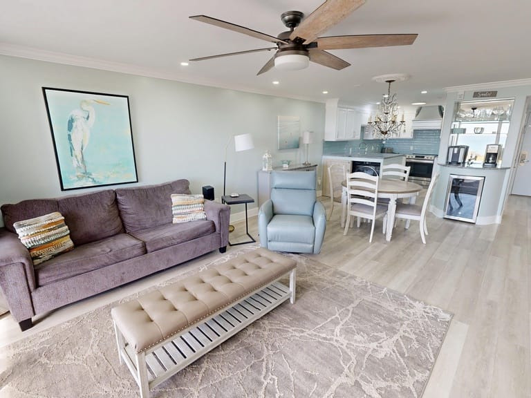 Modern living room with kitchen attached.