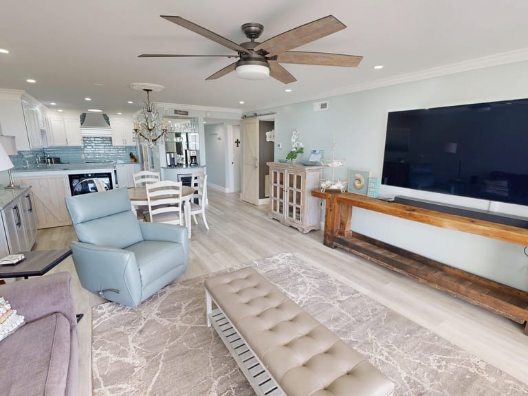 Modern living room with kitchen view.