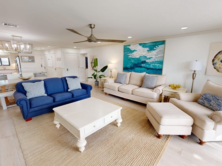 Modern living room with blue sofa.