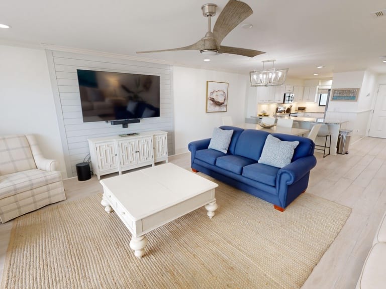 Modern living room with blue sofa.