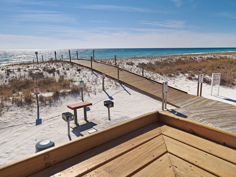 Wooden boardwalk leading to beach.