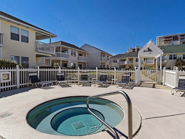 Hot tub surrounded by chairs.