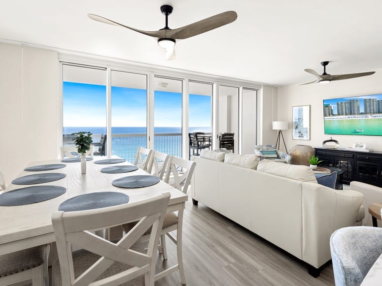 Modern living room, ocean view balcony.