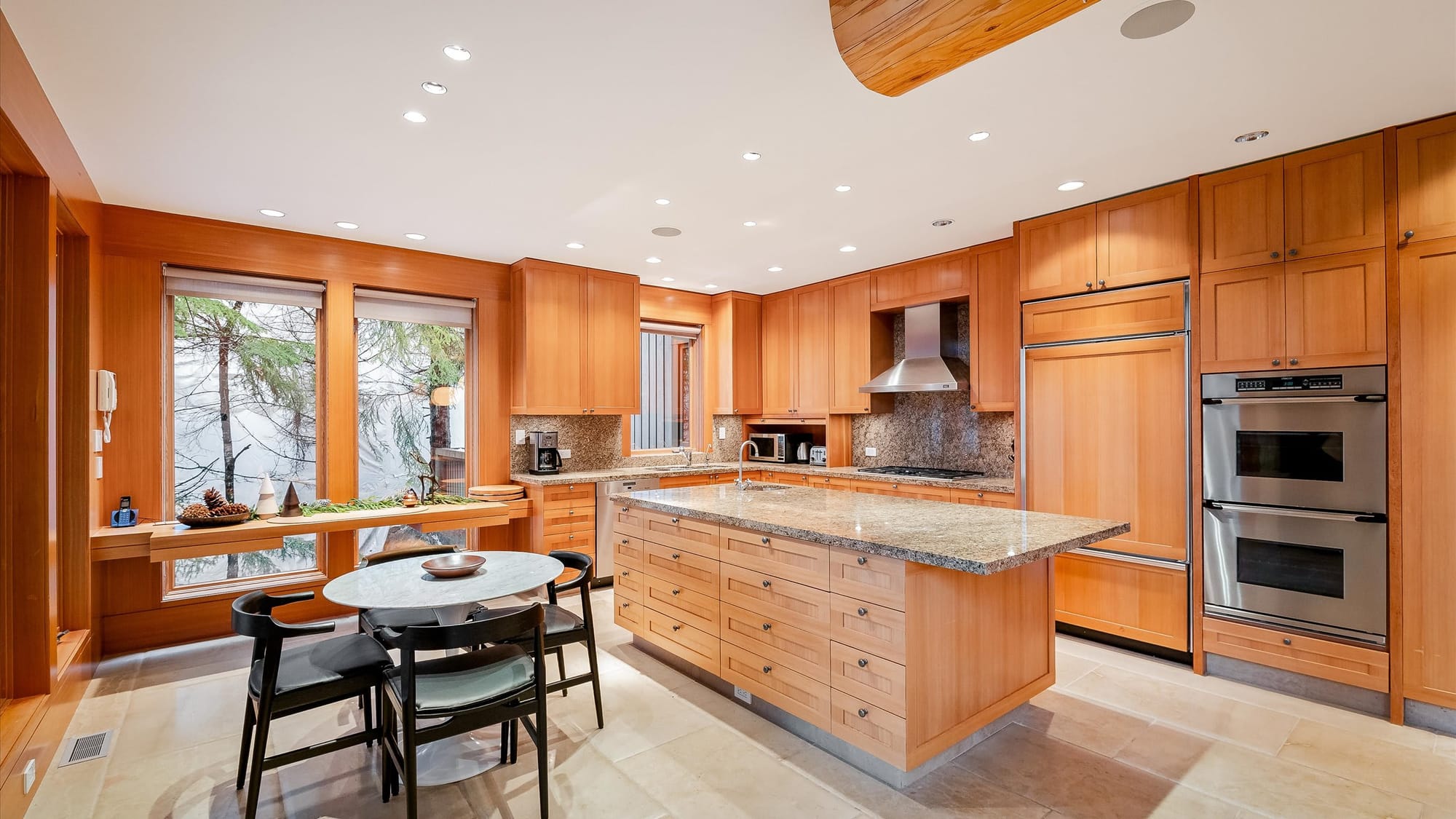 Spacious kitchen with wooden cabinets.