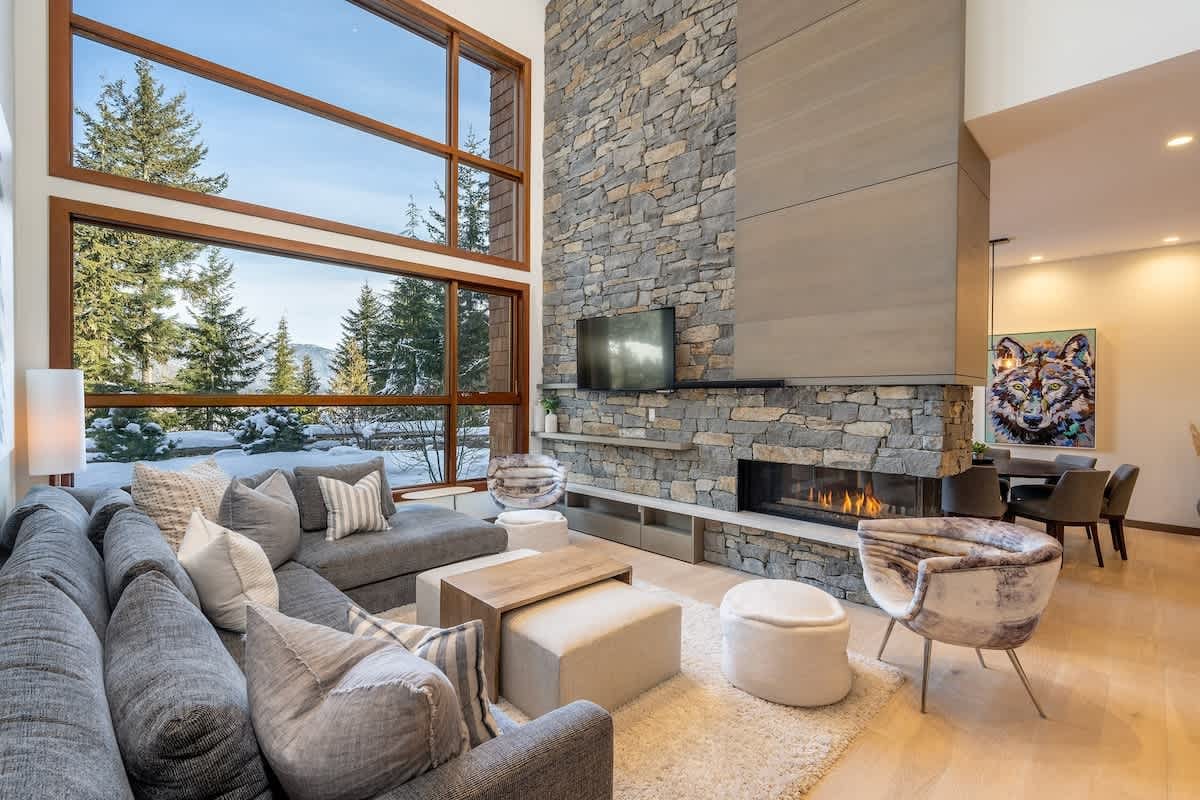 Modern living room with large windows.