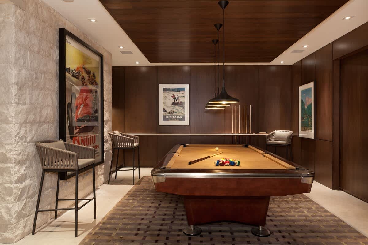 Luxurious billiards room with posters.