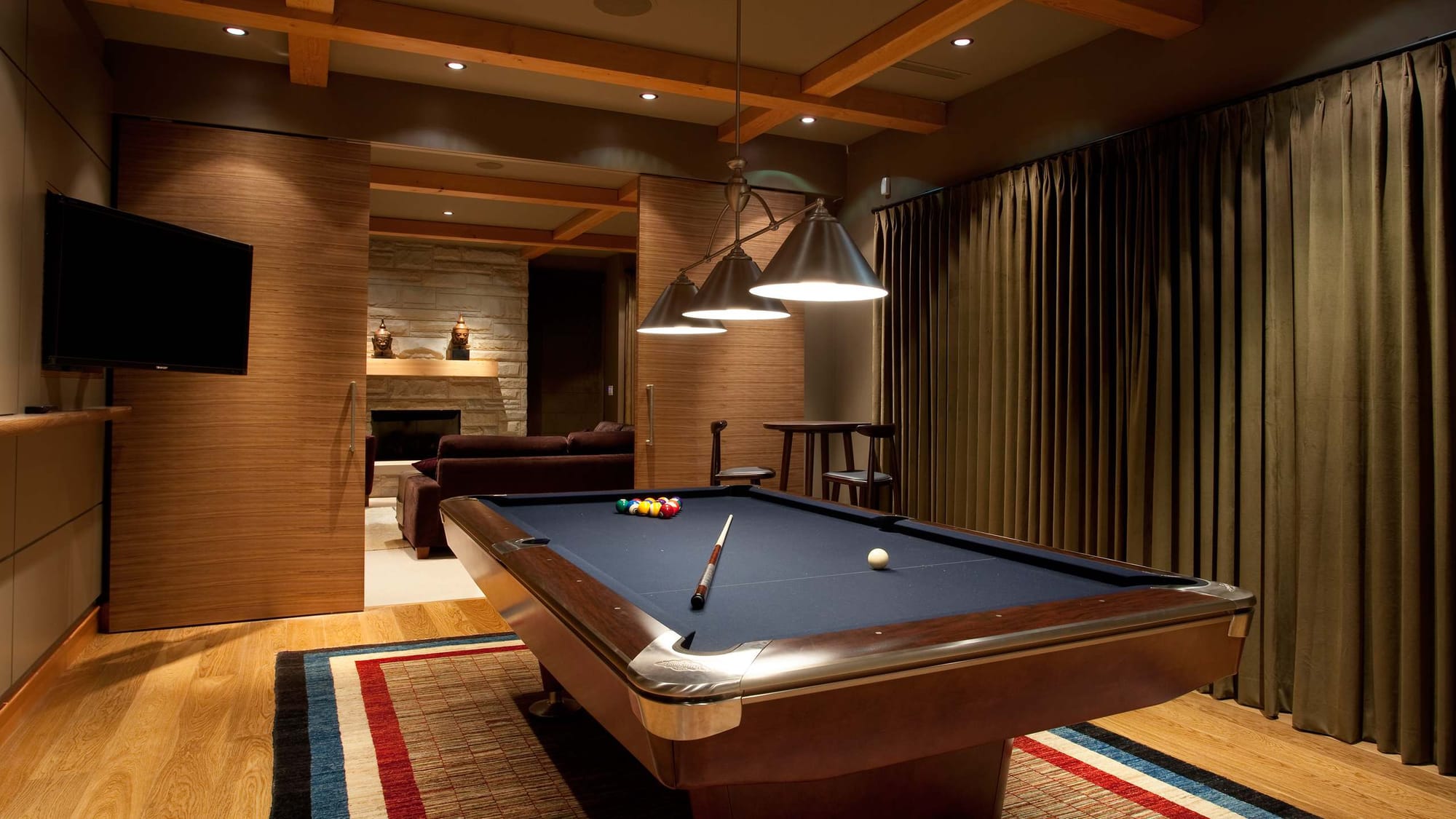 Modern room with billiard table.