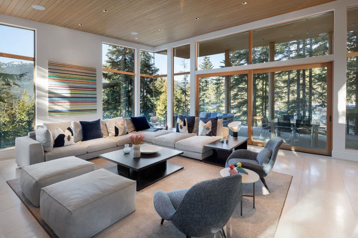 Modern living room with large windows.