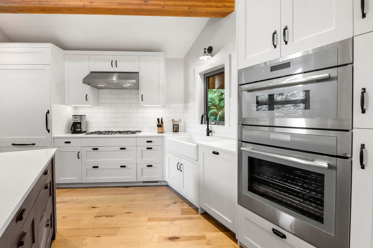 Modern kitchen with white cabinetry.