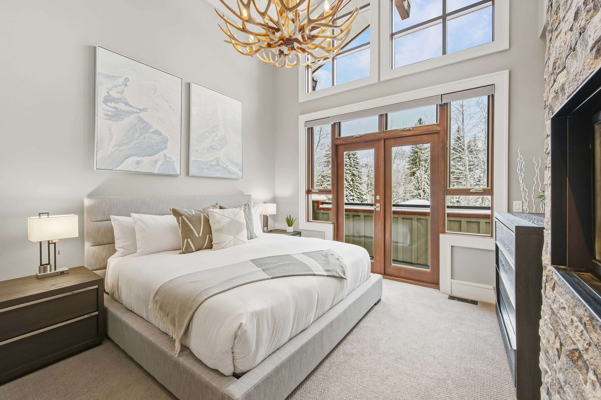 Stylish bedroom with large windows.