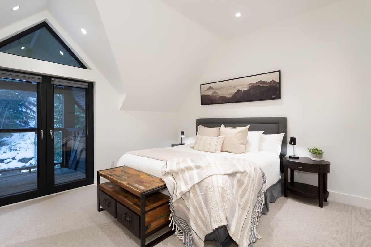 Cozy bedroom with large window.