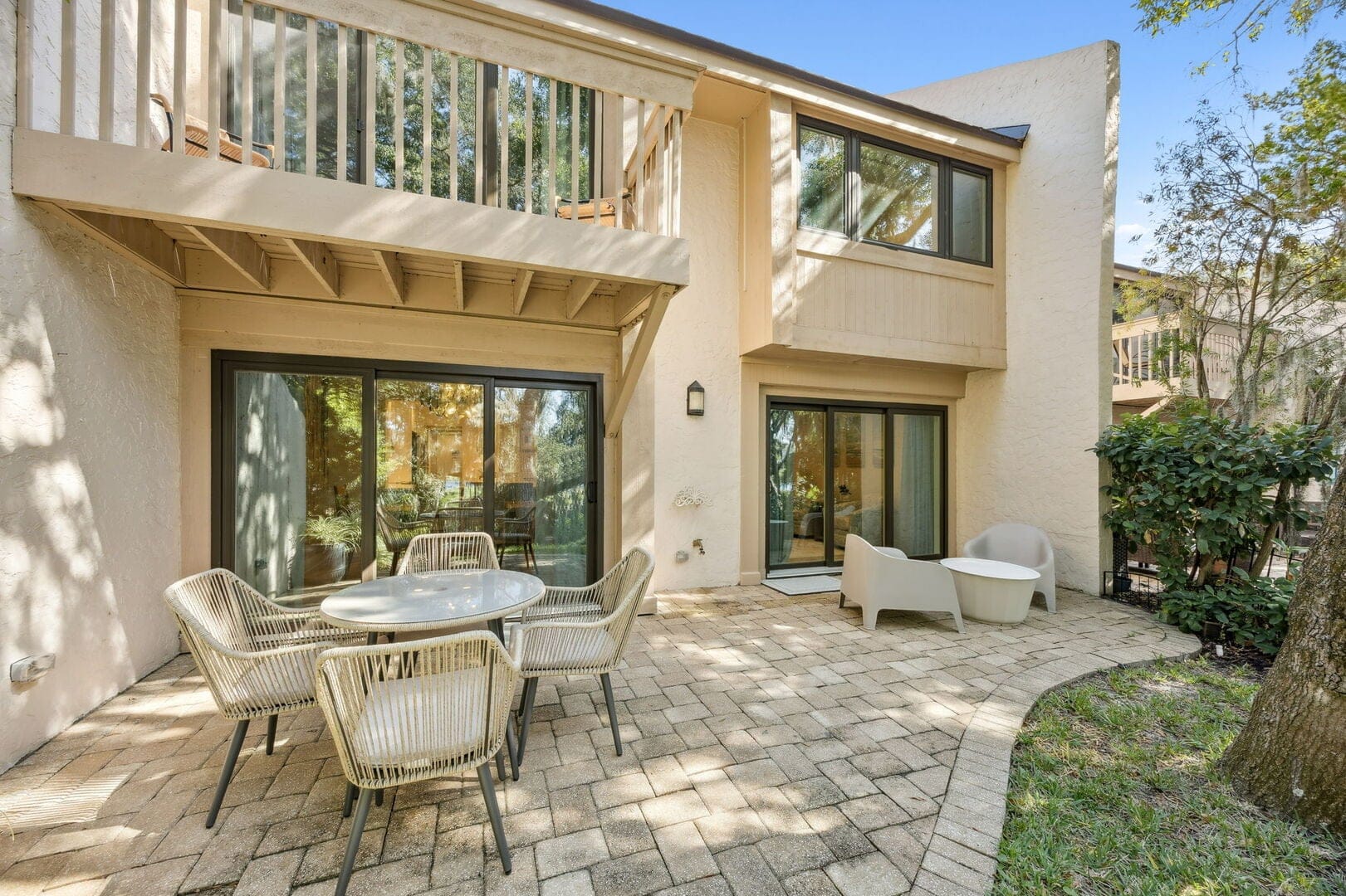 Sunlit patio with outdoor furniture.