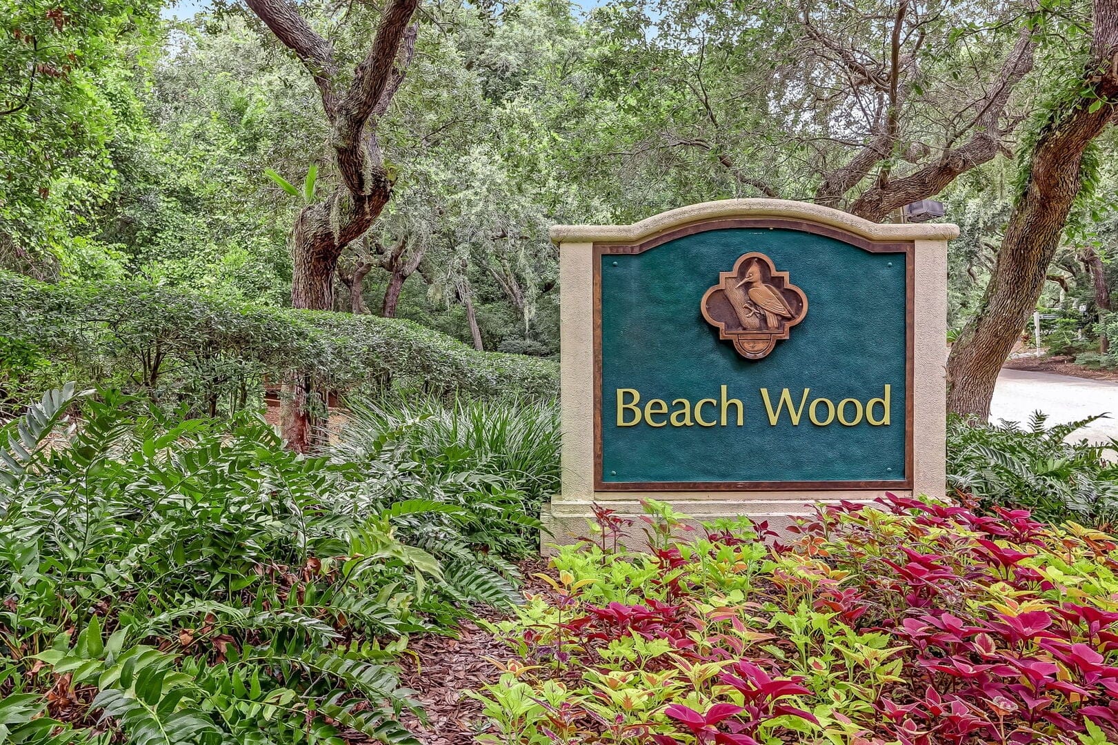 Beach Wood sign in lush greenery.