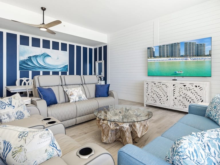 Coastal-themed living room with TV.