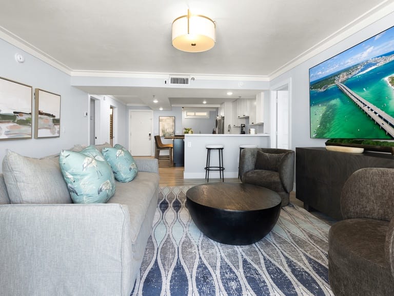 Modern living room with large TV.