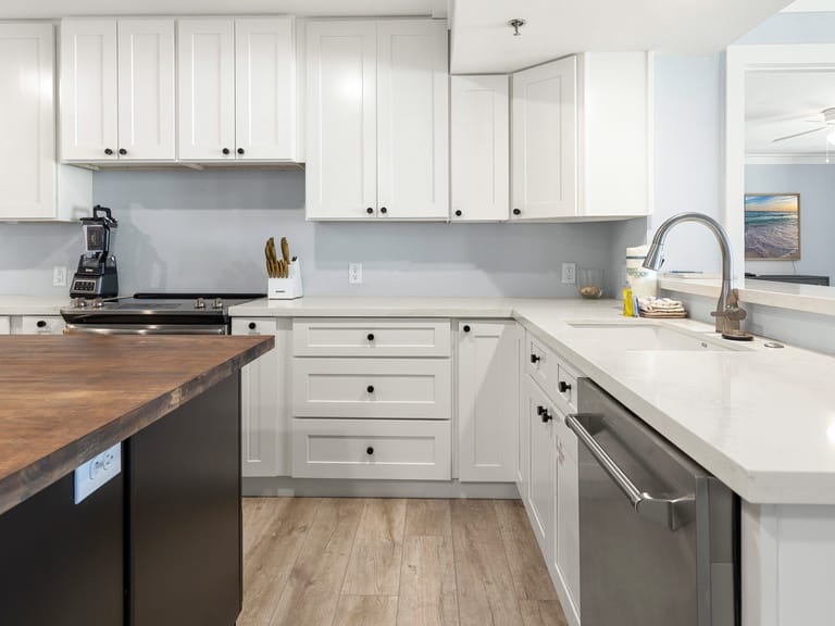 Modern kitchen with white cabinets.