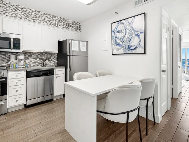 Modern kitchen with dining area.